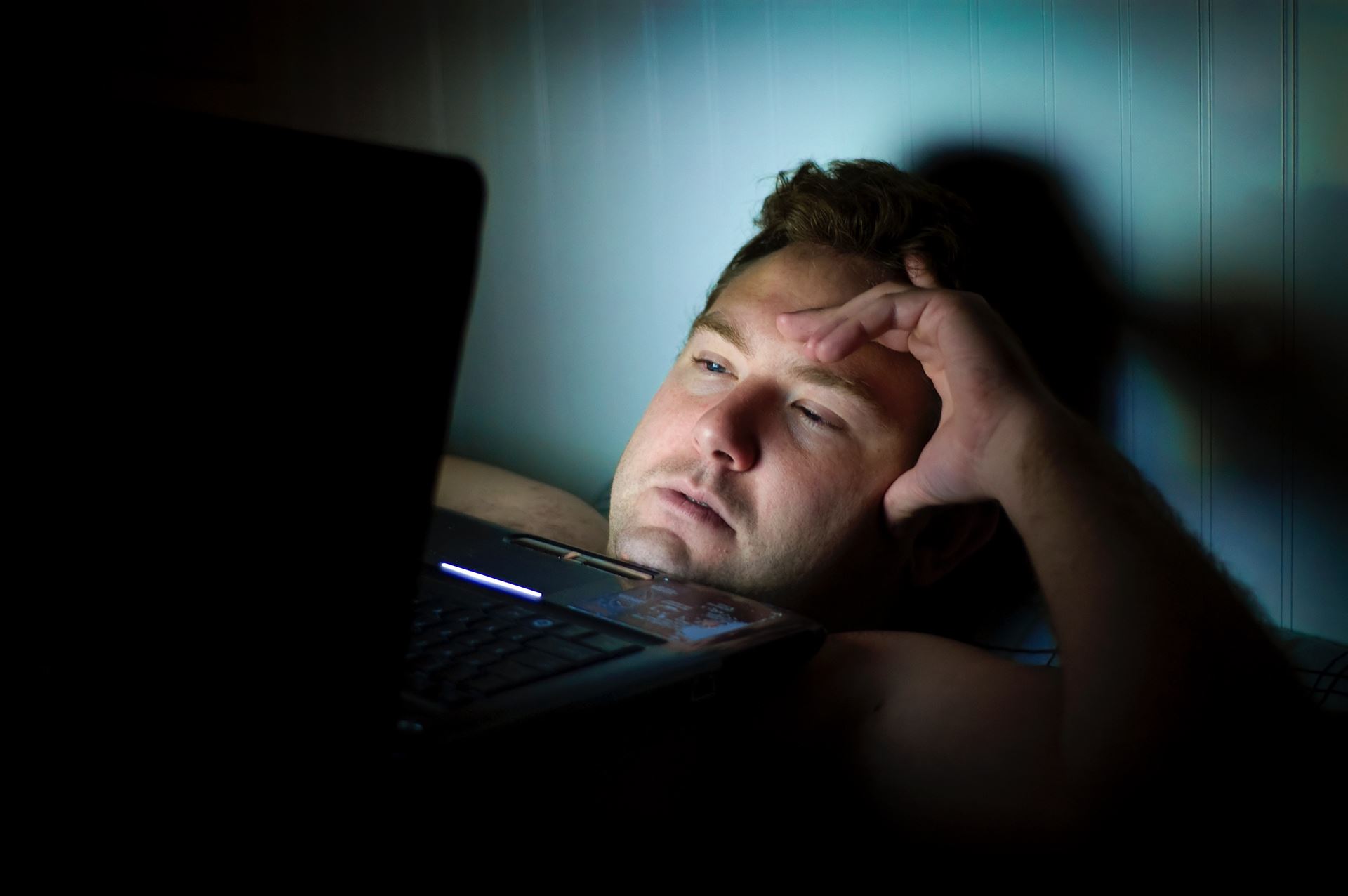 a man using a laptop computer